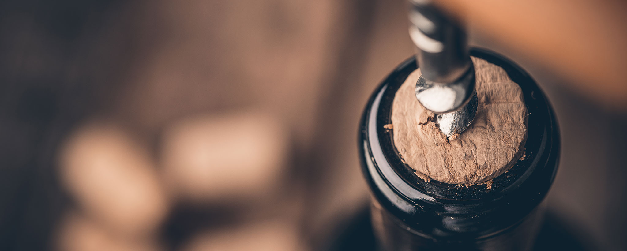 corkscrew opening bottle of wine