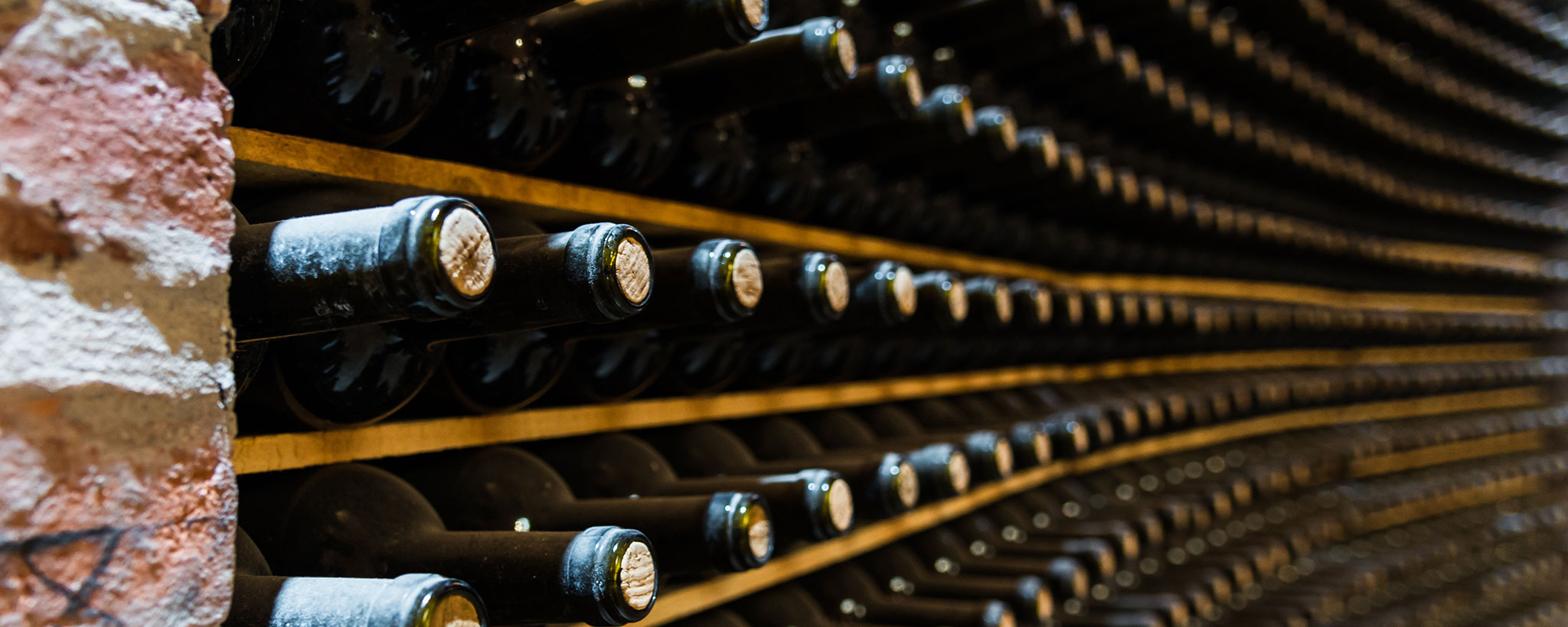 full wall of stored wine bottles
